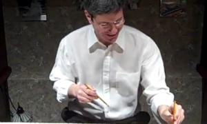 Office Supply Salesman plays flight of the bumble bee wth pencils